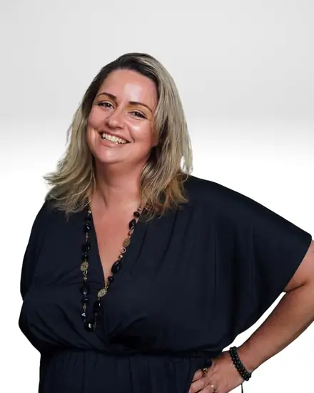 Ashley Boyle, Higher Self Channeller, smiling in a black dress